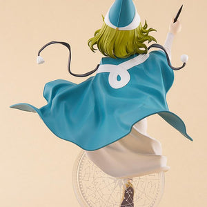 Rear studio angle of the POP UP PARADE L Coco figure showcasing the flow of her large teal capelet, knotted white ribbon, and pointed hat.