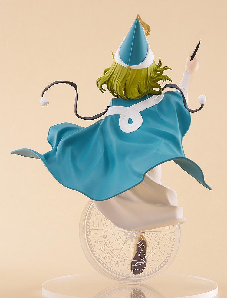 Rear studio angle of the POP UP PARADE L Coco figure showcasing the flow of her large teal capelet, knotted white ribbon, and pointed hat.