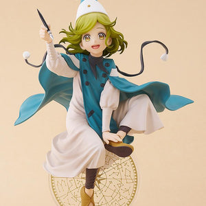 Full-body studio shot of the Coco anime figure floating above a clear magic circle display base against a solid light beige background.