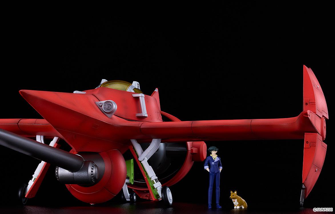 Grounded Swordfish II model kit displayed next to scale miniature figures of a standing Spike Spiegel and Ein the Corgi.