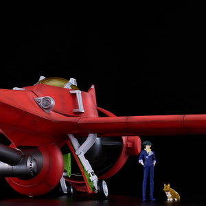 Grounded Swordfish II model kit displayed next to scale miniature figures of a standing Spike Spiegel and Ein the Corgi.