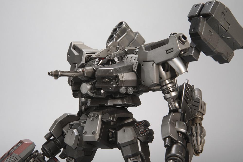Close-up macro view of the upper torso and head unit of the Kotobukiya Crest CR-C90U3 model kit, highlighting fine mechanical lines, panel gaps, and shoulder weapons.