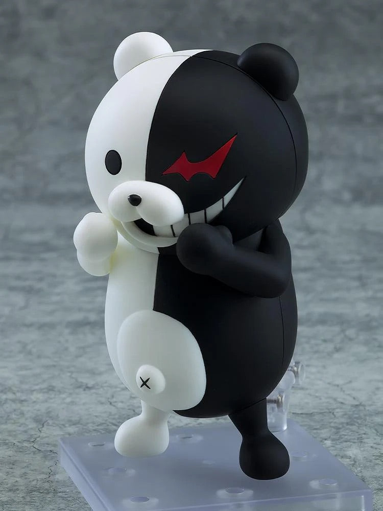 Close-up of the Nendoroid Monokuma figure, emphasizing the smile on the white side and the evil grin on the black side.