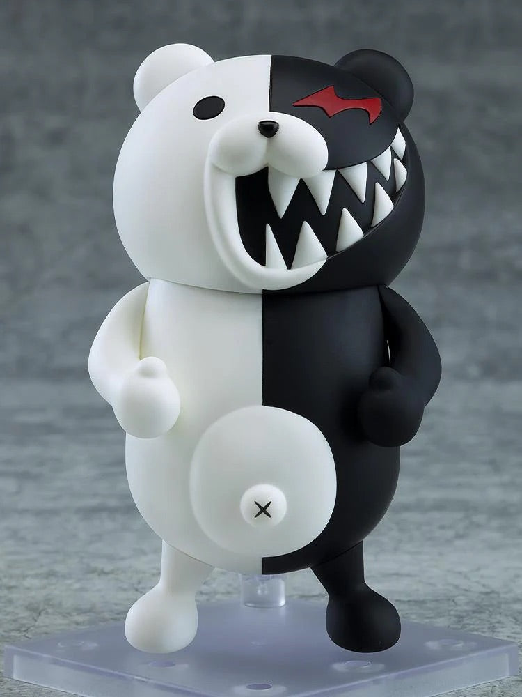 Nendoroid Monokuma figure with the laughing face plate, showing the wide-open mouth and sharp teeth on the black side.