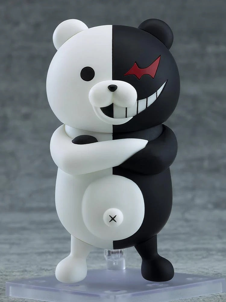 Nendoroid Monokuma figure with the smiling face plate, posed with his arms crossed, showing the classic black and white color split.