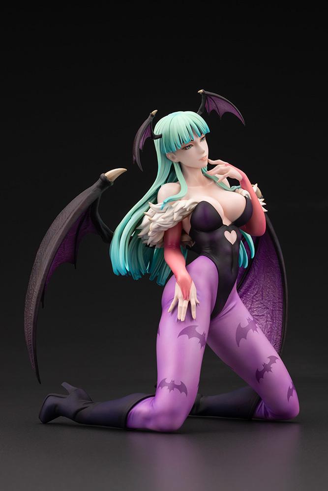Dynamic low-angle side view of the Kotobukiya Darkstalkers Morrigan figure in her signature kneeling succubus pose.