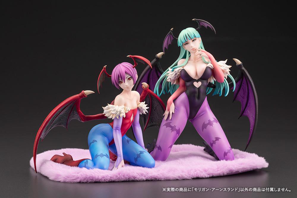 Display setup featuring the 1/7 scale Morrigan Aensland figure displayed next to the Lilith figure on the included pink plush cloth base.