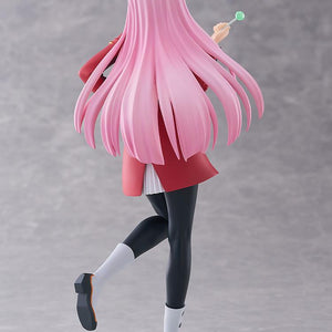 Rear studio view of the Pop Up Parade L Zero Two figure highlighting her long flowing pink hair, red pilot uniform coat, and black tights.