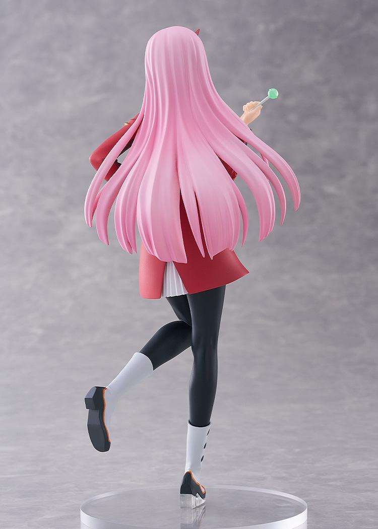 Rear studio view of the Pop Up Parade L Zero Two figure highlighting her long flowing pink hair, red pilot uniform coat, and black tights.