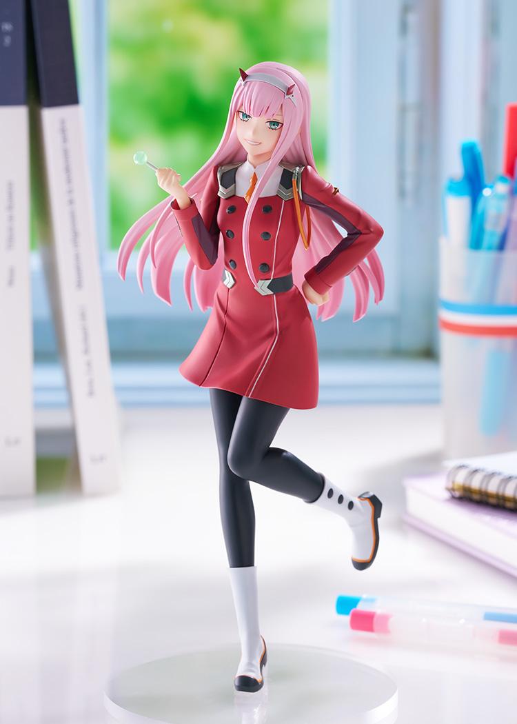 Vertical lifestyle shot of the Darling in the Franxx Zero Two Pop Up Parade L figure standing in natural daylight on a desktop.