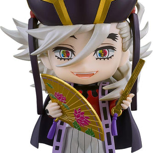 Isolated product studio view of the Good Smile Company Demon Slayer Doma Nendoroid figure holding two fans.