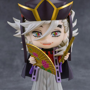 Demon Slayer: Kimetsu no Yaiba Doma Nendoroid figure standing on display base holding gold lotus fans with smiling faceplate.