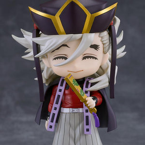 Demon Slayer Doma Nendoroid figure featuring closed-eye mesmerized faceplate and holding a closed fan.
