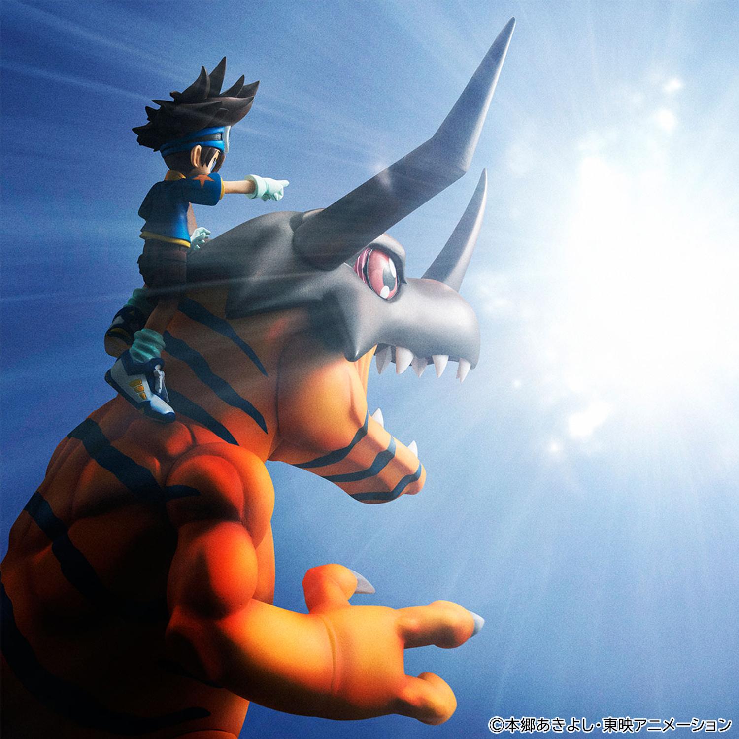Dramatic promotional photo of Taichi Yagami and Greymon figure backlit with glowing blue light effect