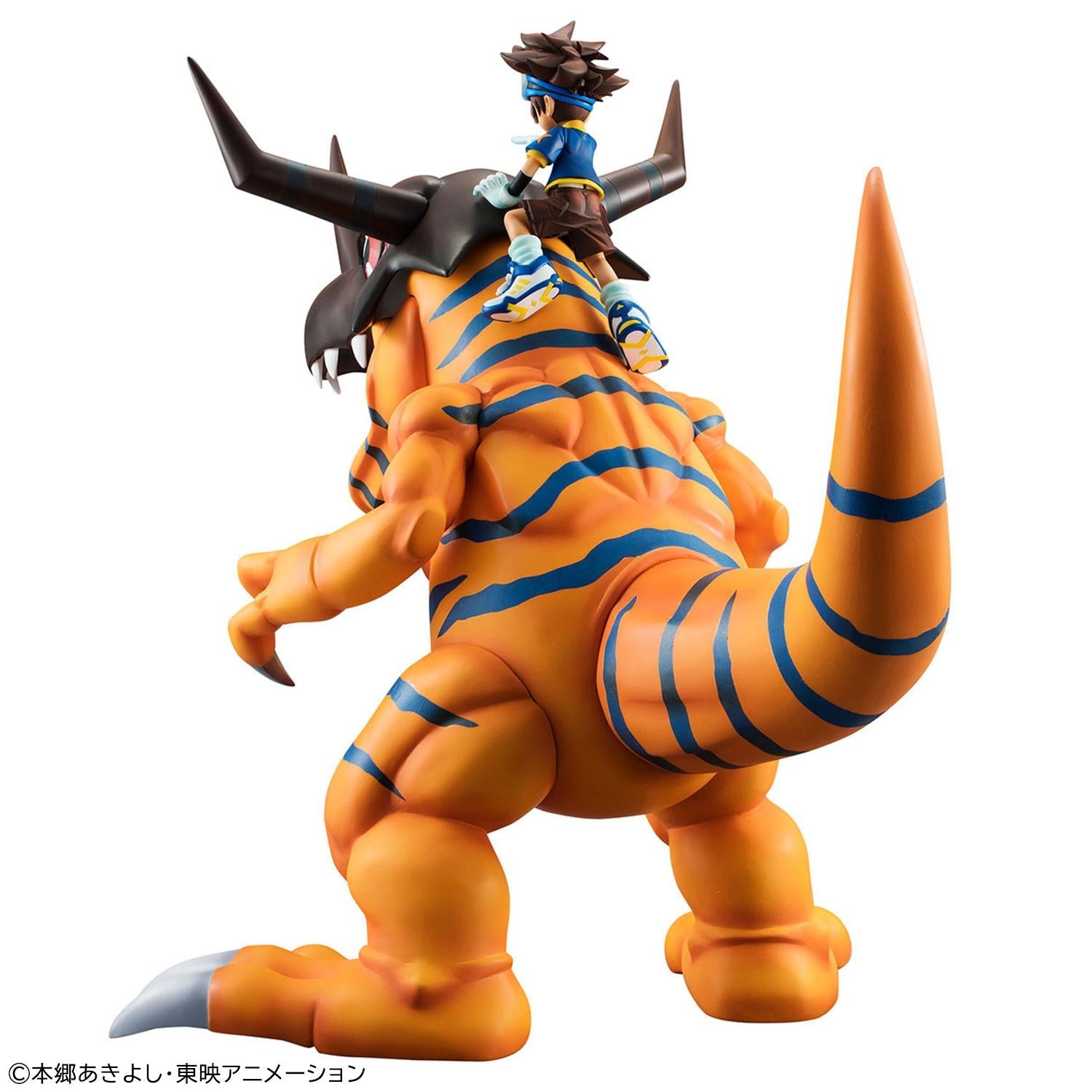 Rear view of the Precious G.E.M. Greymon figure displaying blue body stripes and Tai Yagami seated on his neck