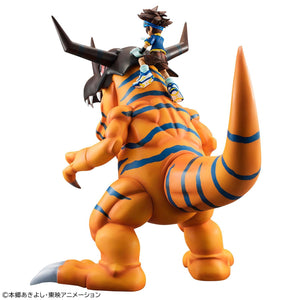 Rear view of the Precious G.E.M. Greymon figure displaying blue body stripes and Tai Yagami seated on his neck
