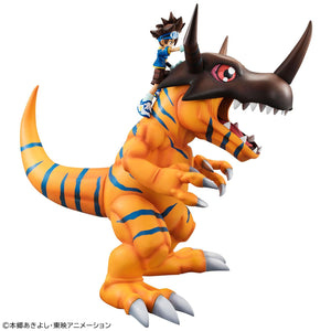Side profile view of the roaring Greymon figure with Taichi Kamiya pointing ahead from Greymon's helmet