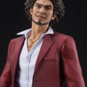 A close-up of the Ichiban Kasuga figure's face, featuring his stylized, confident smile and iconic hairstyle.