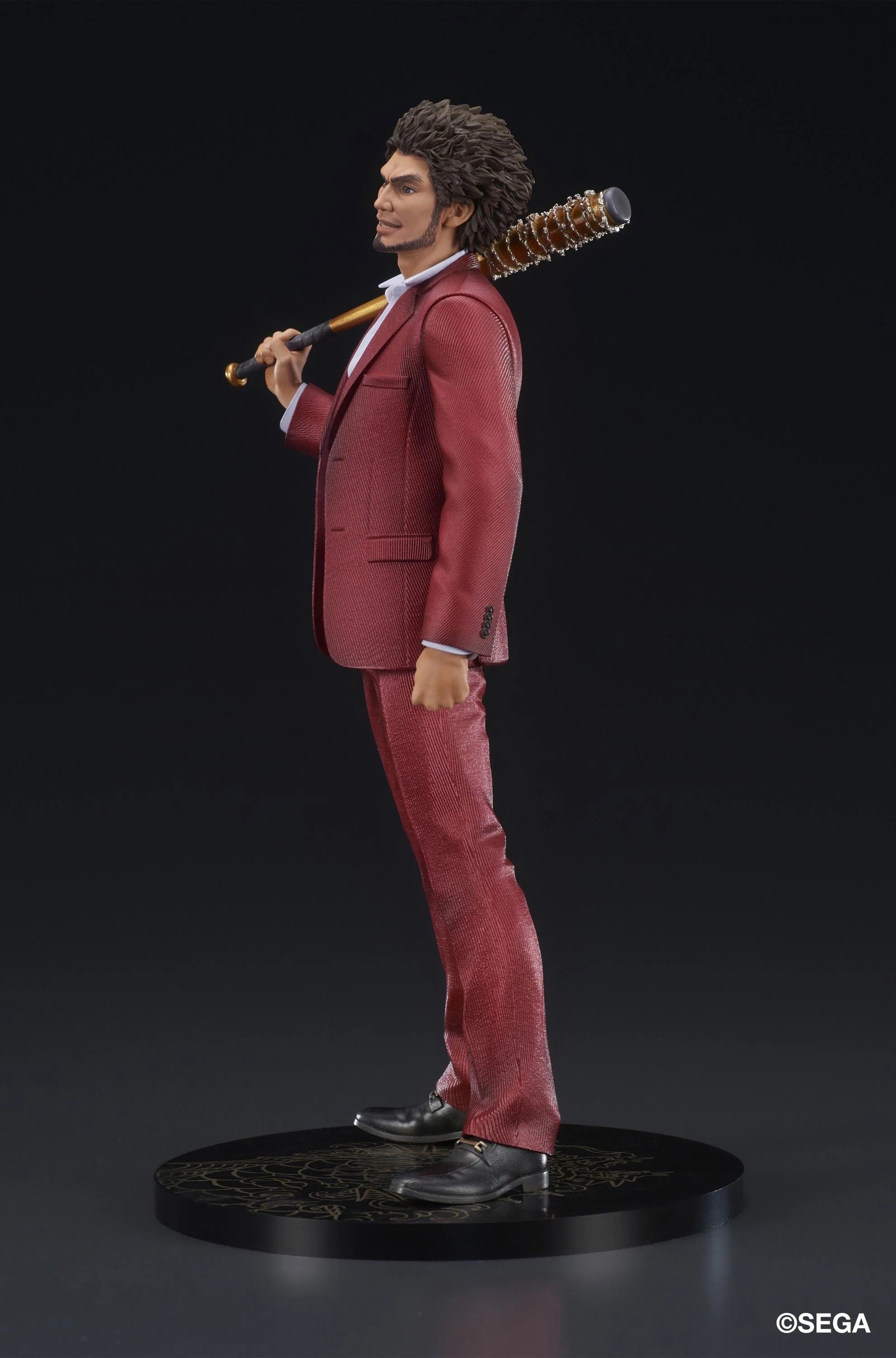 Side profile of the Ichiban Kasuga figure, showing him with the spiked, golden bat resting on his shoulder.