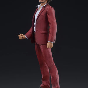 Side profile of the Ichiban Kasuga figure in his red suit, highlighting the determined expression and pose.