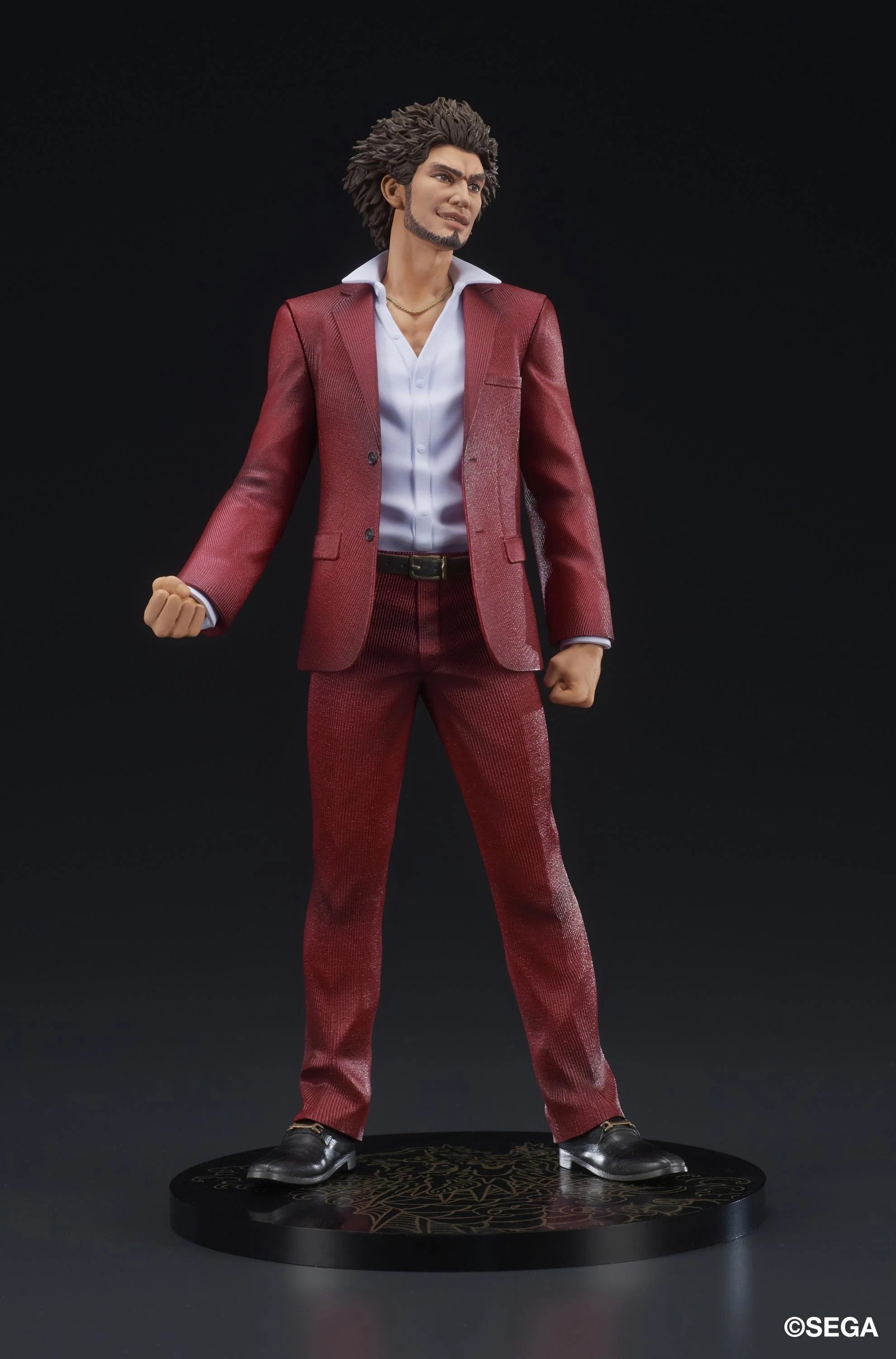 A three-quarter front view of the Ichiban Kasuga figure, emphasizing the texture of the red suit.