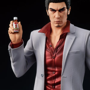 A close-up of the Kazuma Kiryu figure's face, showing his intense expression and holding the bottle of Staminan X.