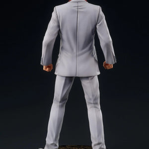 Rear view of the Kazuma Kiryu figure, highlighting the fit of his gray suit and the golden Oryu dragon pattern on the display base.