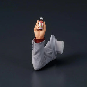 A shot of the interchangeable arm accessory for the Kiryu figure, holding the small Staminan X bottle.