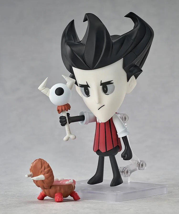 Nendoroid Wilson figure holding the "Eye Bone" accessory, with the small, brown Chester accessory at his feet.