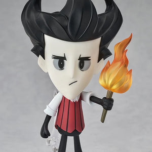 Nendoroid Wilson figure posed holding the torch accessory and standing in his red striped vest and black attire.