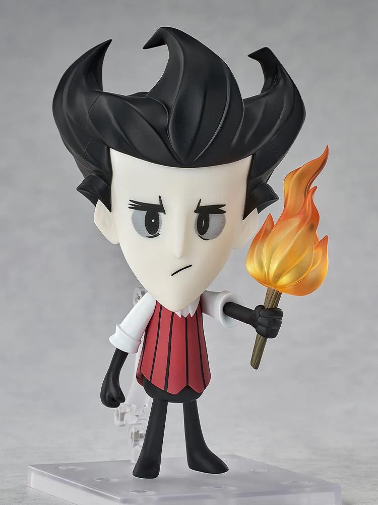 Nendoroid Wilson figure posed holding the torch accessory and standing in his red striped vest and black attire.