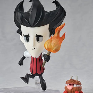 Nendoroid Wilson figure posed running with the torch, with the adorable, mouth-open Chester accessory at his side.