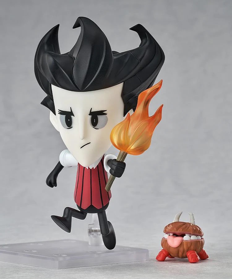 Nendoroid Wilson figure posed running with the torch, with the adorable, mouth-open Chester accessory at his side.