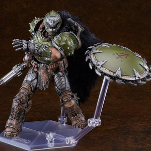Deluxe Doom Slayer figma figure demonstrating the throwing action of his circular chain shield, which is mounted on an independent clear support arm.