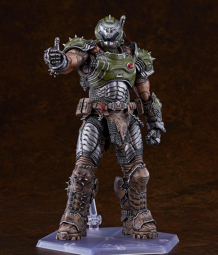 Studio shot of the Doom Slayer deluxe action figure gesturing with a confident thumbs-up using an interchangeable armored hand.
