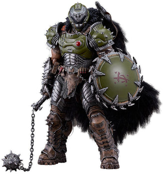 Front product view of the Doom: The Dark Ages Doom Slayer figma DX Edition figure, showcasing his heavy green armor, fur cape, chain shield, and the deluxe flail weapon resting on the ground.
