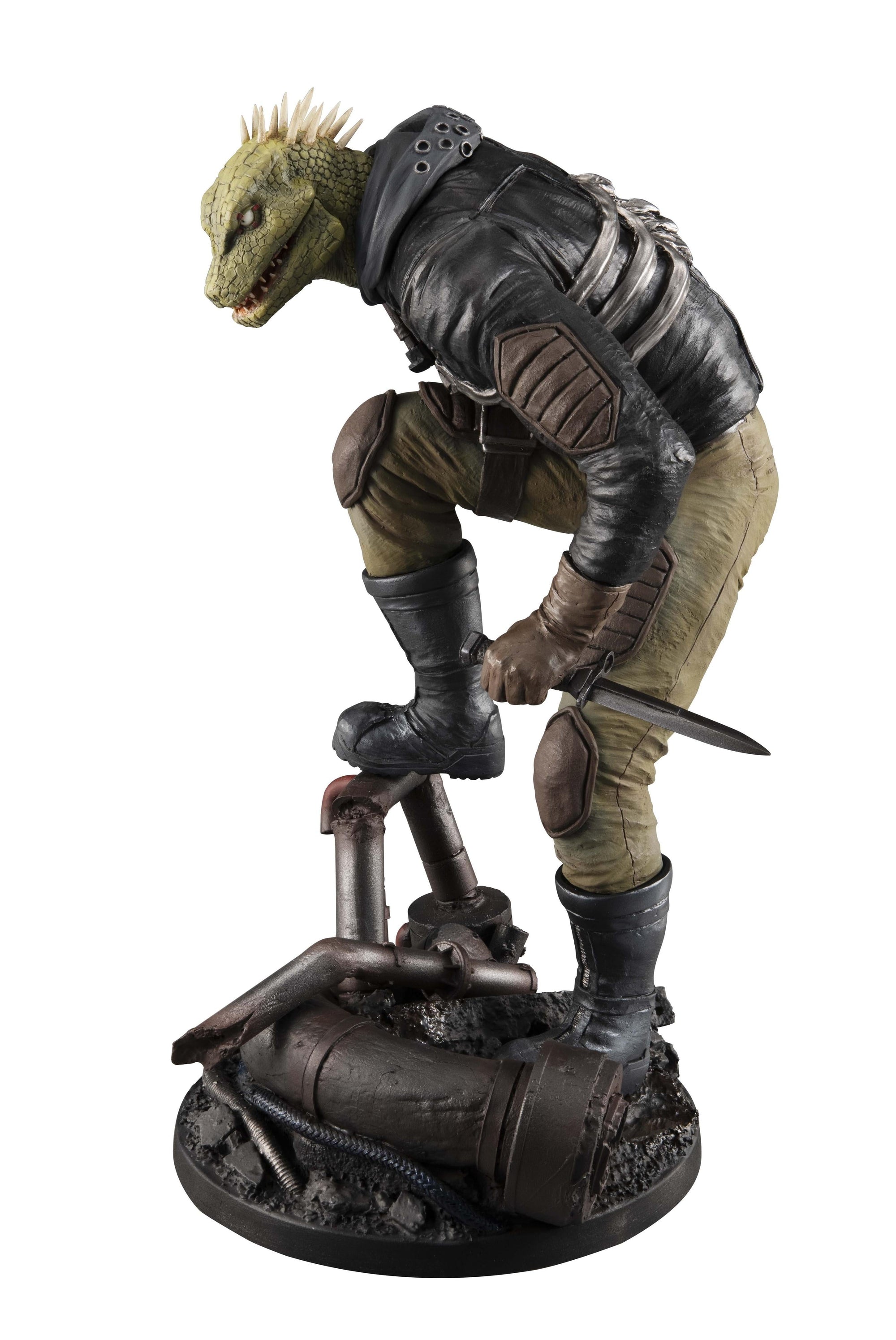 Side profile view of the Caiman figure with his bare reptilian head, highlighting the spiked crest and textured leather jacket.