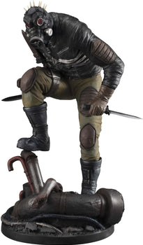 Front view of the 1/8 scale Caiman figure from Dorohedoro wearing his iconic gas mask with spikes and holding dual knives on a debris base.