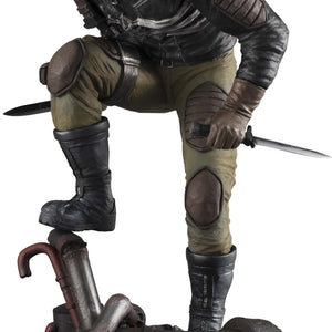 Front view of the 1/8 scale Caiman figure from Dorohedoro wearing his iconic gas mask with spikes and holding dual knives on a debris base.