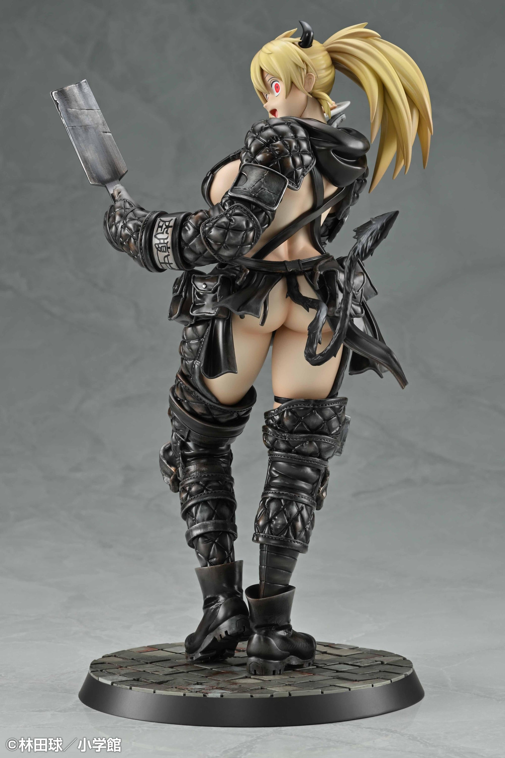 Rear three-quarter view of the Nikaido anime figure focusing on the spiked tip of her devil tail and combat gear details.