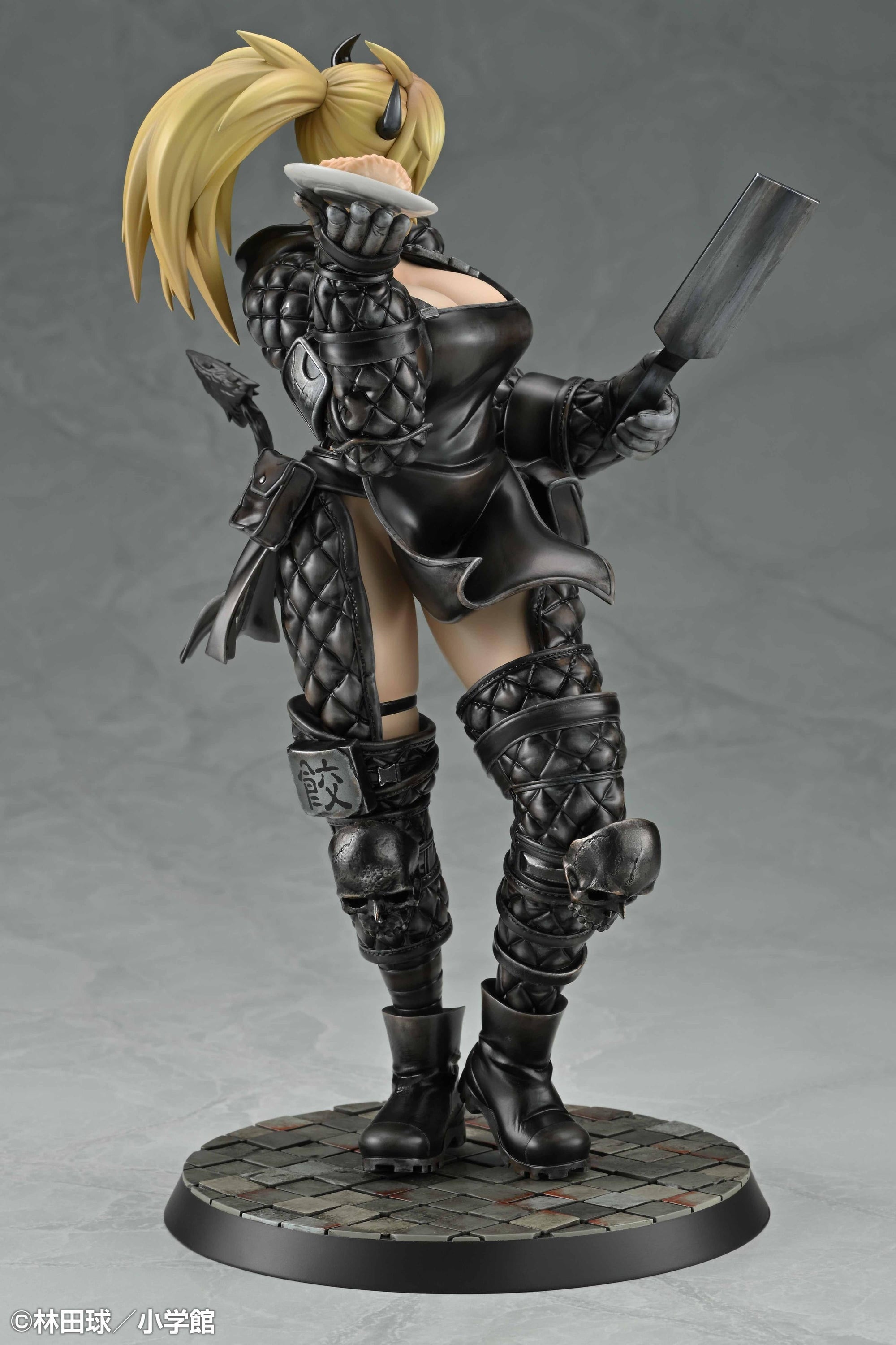 Right side view of the Nikaido collectible statue highlighting her combat boots, armor straps, and the skull motif on her knee guards.