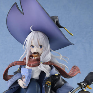 Close-up upper body shot of the Elaina scale figure wearing her pointed witch hat and eating a donut while holding a blue snack bag.