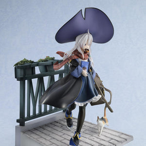 Right profile view of the Elaina witch scale figure accentuating her billowing black robe, long scarf, and the calico cat accessory walking alongside her.
