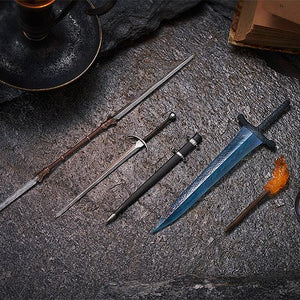 Top-down flat lay view of the detailed figma weapon accessories, including the Twinblade, bastard sword with sheath, Dark Moon Greatsword, flaming torch, and roundshield arranged on a dark stone slab.