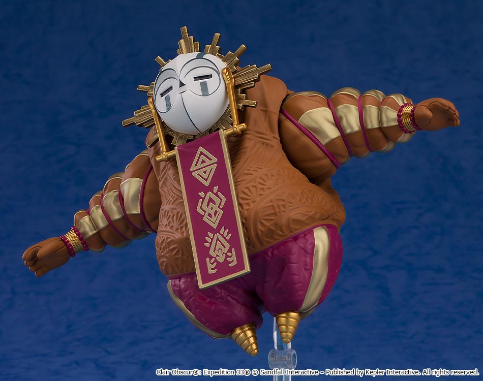 Dynamic action shot of the round Esquie Nendoroid figure angled forward as if floating or diving through the air on its clear peg stand.