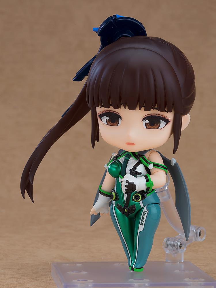 The EVE Nendoroid figure showcasing her interchangeable sad face plate and articulated green combat suit.