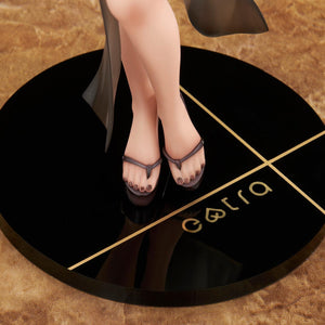 Close-up of the Lilith figure's feet wearing platform sandals with painted toenails, standing on a black circular base with a gold 'extra' logo.