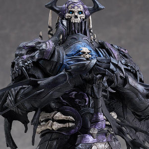 Close-up view of the First Hassan figure showcasing the skull helm, glowing blue eyes, and intricate chest armor details.