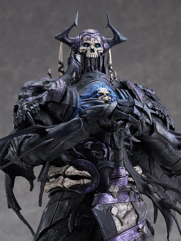 Close-up view of the First Hassan figure showcasing the skull helm, glowing blue eyes, and intricate chest armor details.