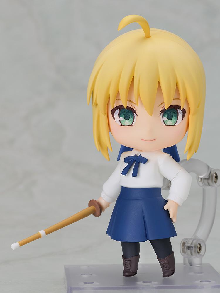 Front view of the Saber Casual Outfit Version Nendoroid figure holding a bamboo shinai, displayed on a clear plastic stand against a light gray background.
